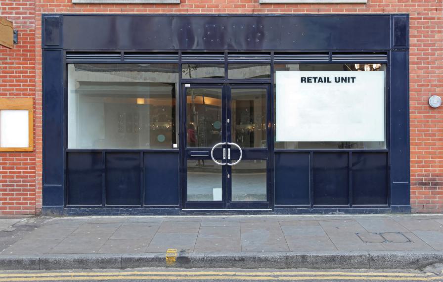 Empty store front, sign reads Retail Unit