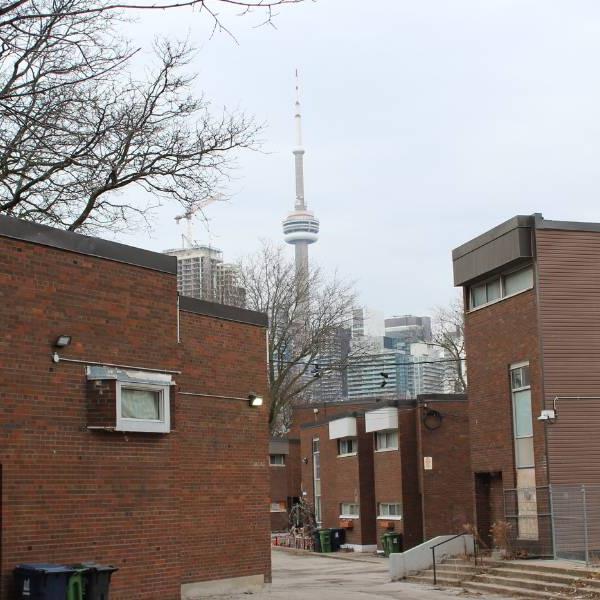 View of Alexandra Park townhouses with CN Tower in the background.