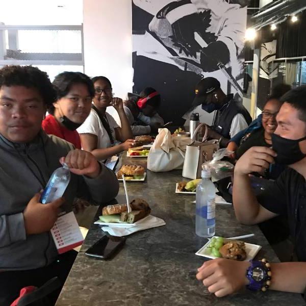A group of Youthworx employees enjoying a meal together