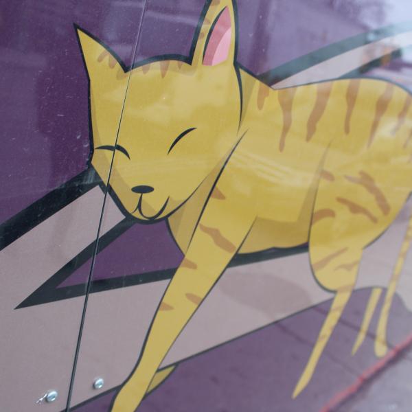 Mural illustration of a yellow cat