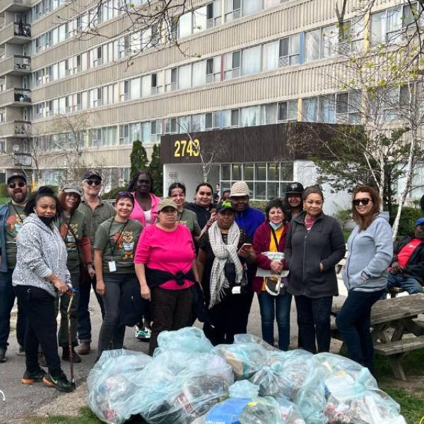 Conservation group standing outside a TCHC building after collecting garbage