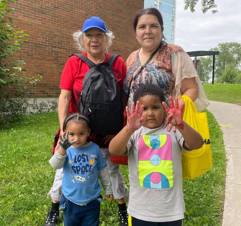 Georgina Baker (L) and Crystal Lizotte (R) with their children at the Gordonridge Community back-to-school giveaway event.